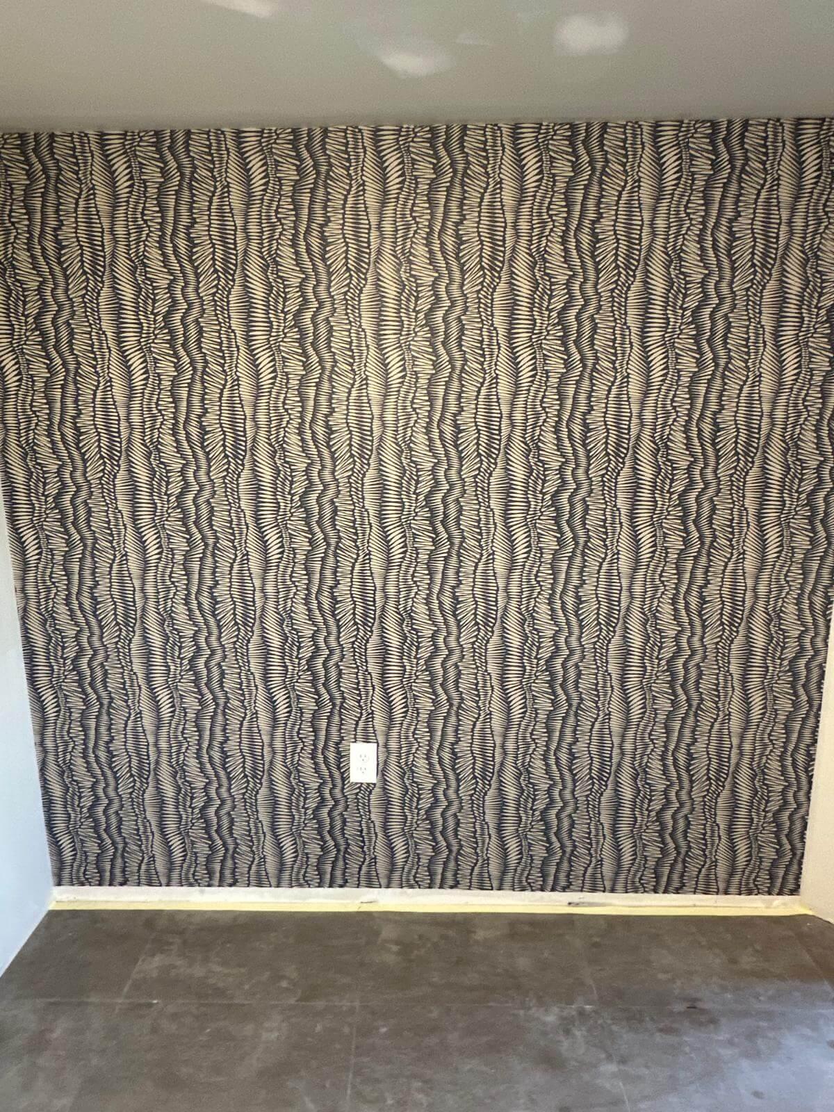 Accent wall showing zentangle or zigzag wallpaper.